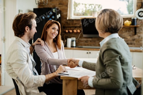 Preview: Young happy couple came to an agreement with insurance agent.