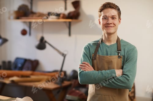 Preview: Cheerful Craftsman With Arms Crossed