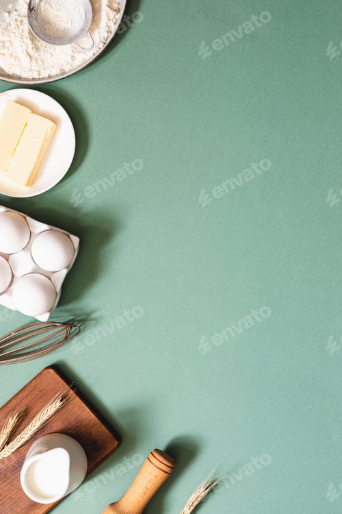 Preview: Frame of food ingredients for baking on a green pastel background