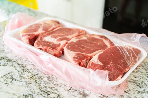 Preview: Unpacking Rib Eye Steak in Modern Kitchen