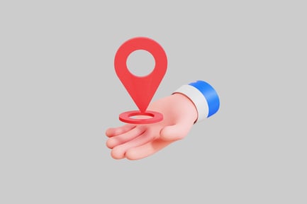 Preview: Hand holding a red location pin