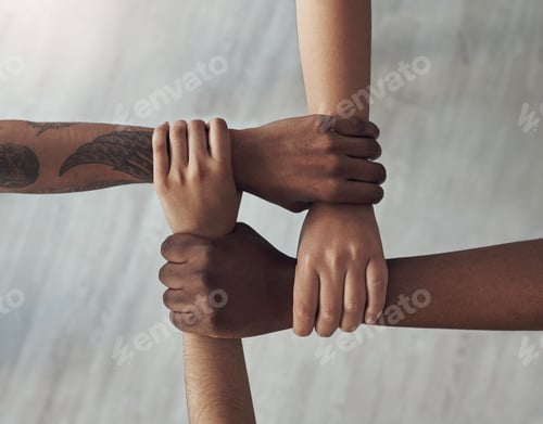 Preview: United we are strong. Cropped shot of a group of unrecognizable people holding each others wrists.