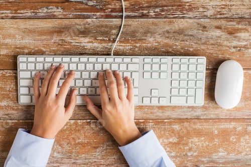 Preview: close up of hands typing on keyboard