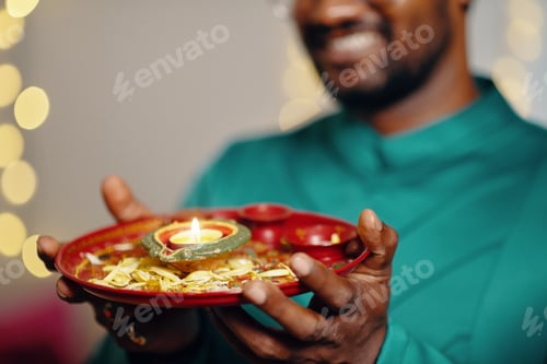 Preview: Holding Traditional Indian Oil Lamp During Religious Ceremony