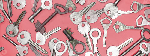 Preview: Keys set on pink background. Door lock keys and safes for proper
