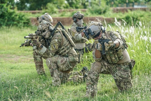 Preview: Soldier in full US MARSOC armed with assault rifle run through the abandoned building. Military