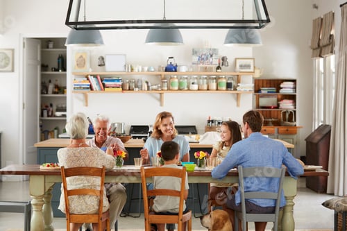 Preview: Three generation family eating in the kitchen at home