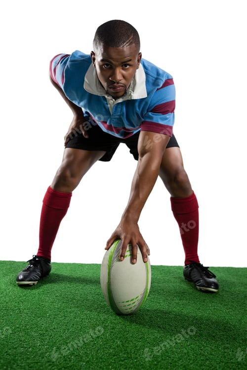 Preview: Full length of male player with rugby ball
