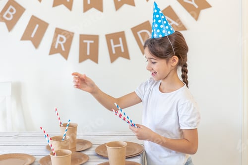 Preview: Happy Girl Celebrating Birthday with Colorful Party Supplies