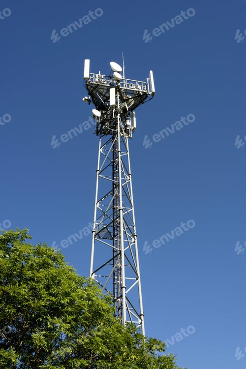 Preview: Low angle shot of a transmission tower in France under a blue sky