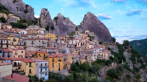 Preview: Charming Castelmezzano village nestled among rugged mountains in Italy during golden hour