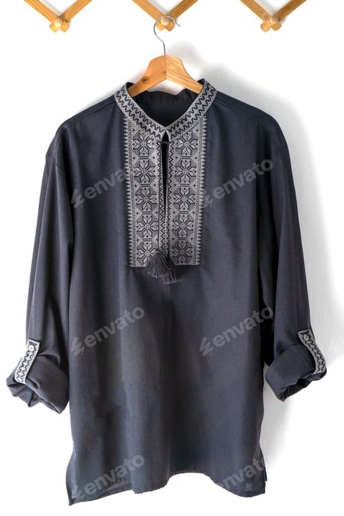 Preview: Ukrainian clothes embroidered man shirt. Blue gray and black threads background. Vyshyvanka is a