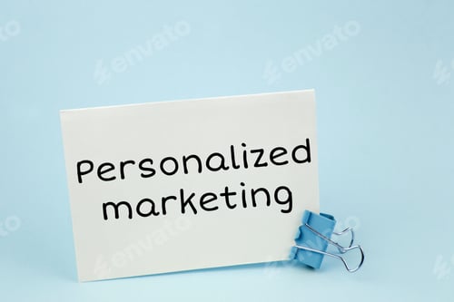 Preview: Personalized marketing. Note written on a white sticker with paper clip.