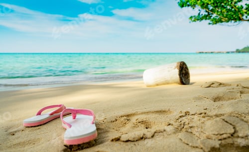 Preview: Pink and white sandals on sand beach. Casual style flip-flop were removed . Summer vacation