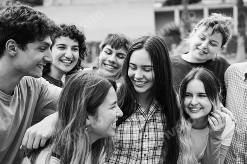 Preview: Young group of friends having fun outdoor - Focus on center girl face - Black and white editing