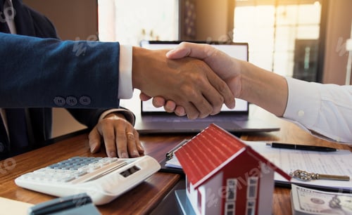 Preview: Home sales agents and buyers work on signing new homes and shaking hands.