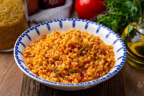 Preview: Traditional turkish bulgur pilaf with tomato sause in plate (Turkish name; meyhane pilavi)