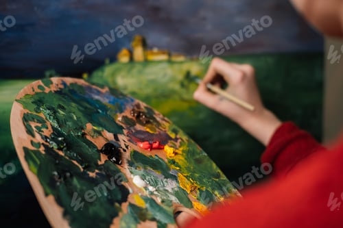 Preview: woman paints a picture with watercolor paint art