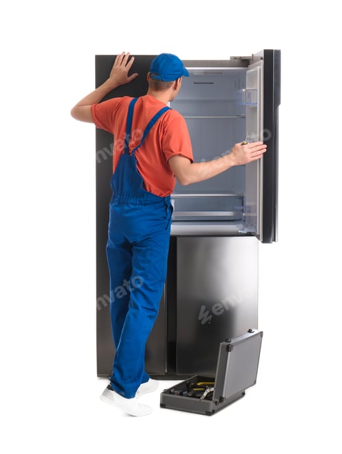 Preview: Male technician repairing refrigerator on white background