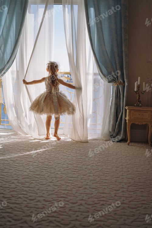 Preview: Little girl looking out big window on sunny morning, sea view apartment