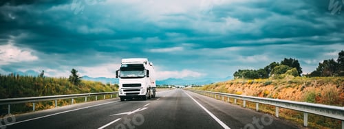 Preview: White Truck Or Traction Unit In Motion On Road, Freeway. Asphalt Motorway Highway Against Background