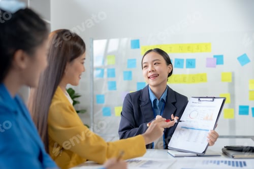 Preview: Team of young Asian businesswomen plan and meeting together and present marketing idea in the office
