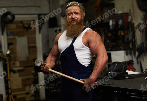 Preview: Athletic blacksmith in workshop