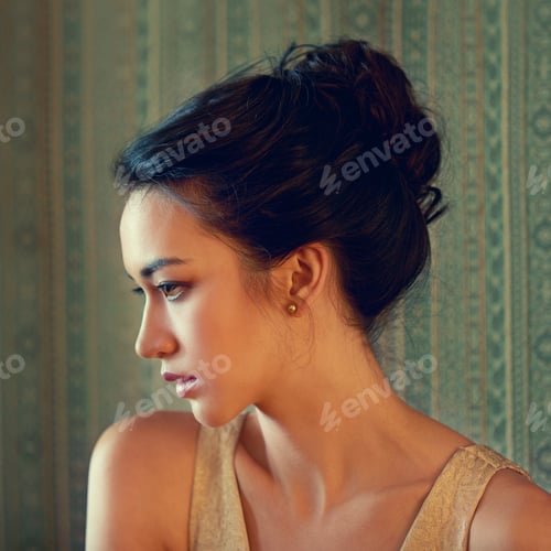 Preview: Elegant Young Woman Poses in Gold Gown