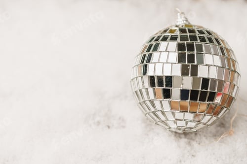 Preview: Shiny disco ball in snow, copy space