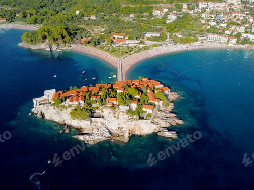 Preview: Aerial view of Sveti Stefan island and shore in a beautiful summer day, Montenegro from flying drone