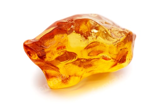 Preview: Natural amber. A piece of yellow opaque natural amber on white background