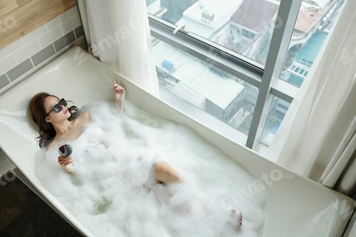 Preview: Woman taking bubble bath
