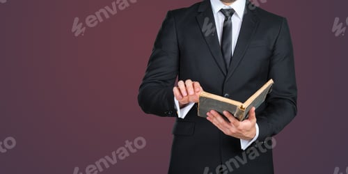 Preview: Business professional reading a book in formal attire with a modern background