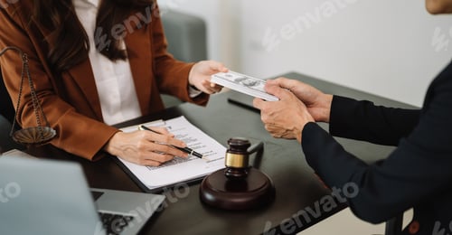 Preview: justice and law concept.passing bribe money in the envelop at office. businessman hand taking