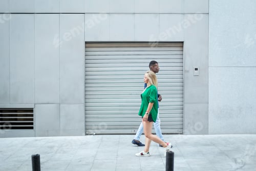 Preview: People of different ethnicities walking in the street