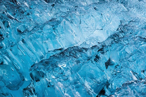 Preview: Abstract blue ice cracks from iceberg in glacier natural background