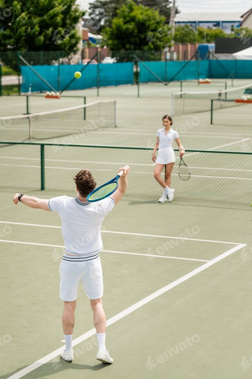 Preview: man hitting tennis ball with racket, athletic woman standing on tennis court, players in active wear