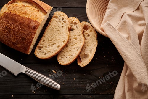 Preview: Homemade tartine bread on dark wooden table