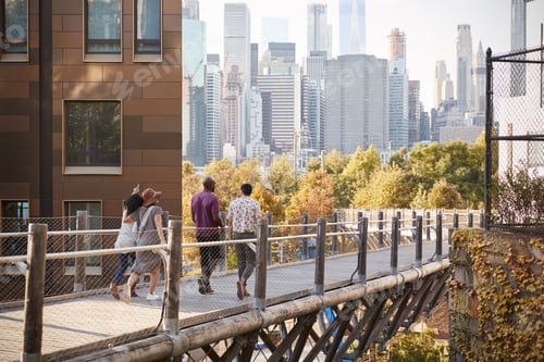 Preview: Group Of Friends Walking With Manhattan Skyline In Background