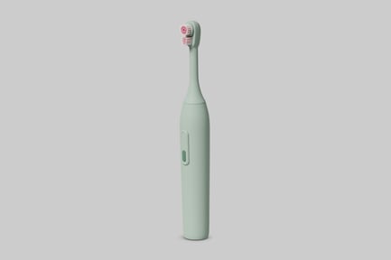 Preview: Electric toothbrush with green handle and red bristles