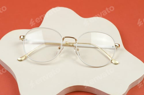 Preview: Stylish women's glasses in a white frame on a white plaster podium