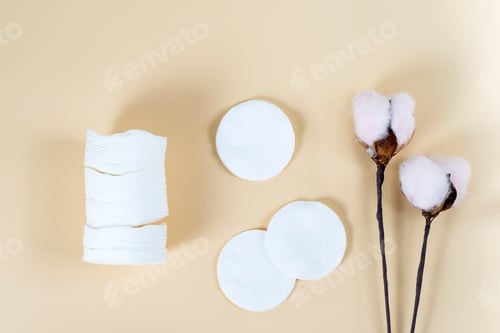 Preview: White organic cotton pads on a beige background