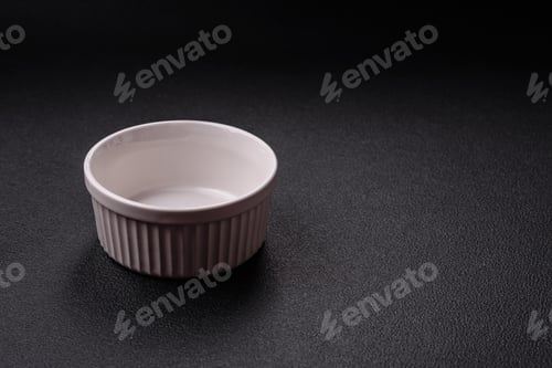 Preview: Beautiful empty white ceramic gravy boat on a concrete background
