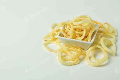Preview: Bowl with tasty snacks on white background