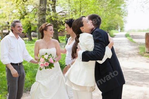 Preview: Couple hugging at wedding party
