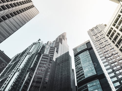 Preview: Looking up at urban group of building with sky and light ray on right side