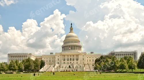 Preview: United States Capital Building beneath a puffy white cloud summer sky