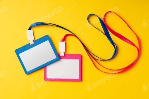 Preview: Colored blank nametags on strings on yellow background