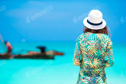 Preview: Young beautiful woman on beach vacation