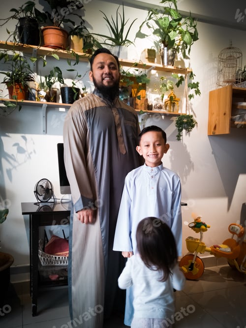 Preview: father and son wearing arabic and malay traditional costume during Eid